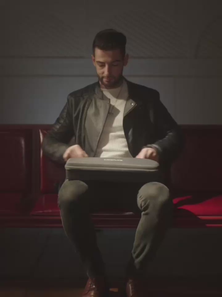 a person opening the LiberLive C1 carrying case for portable use.