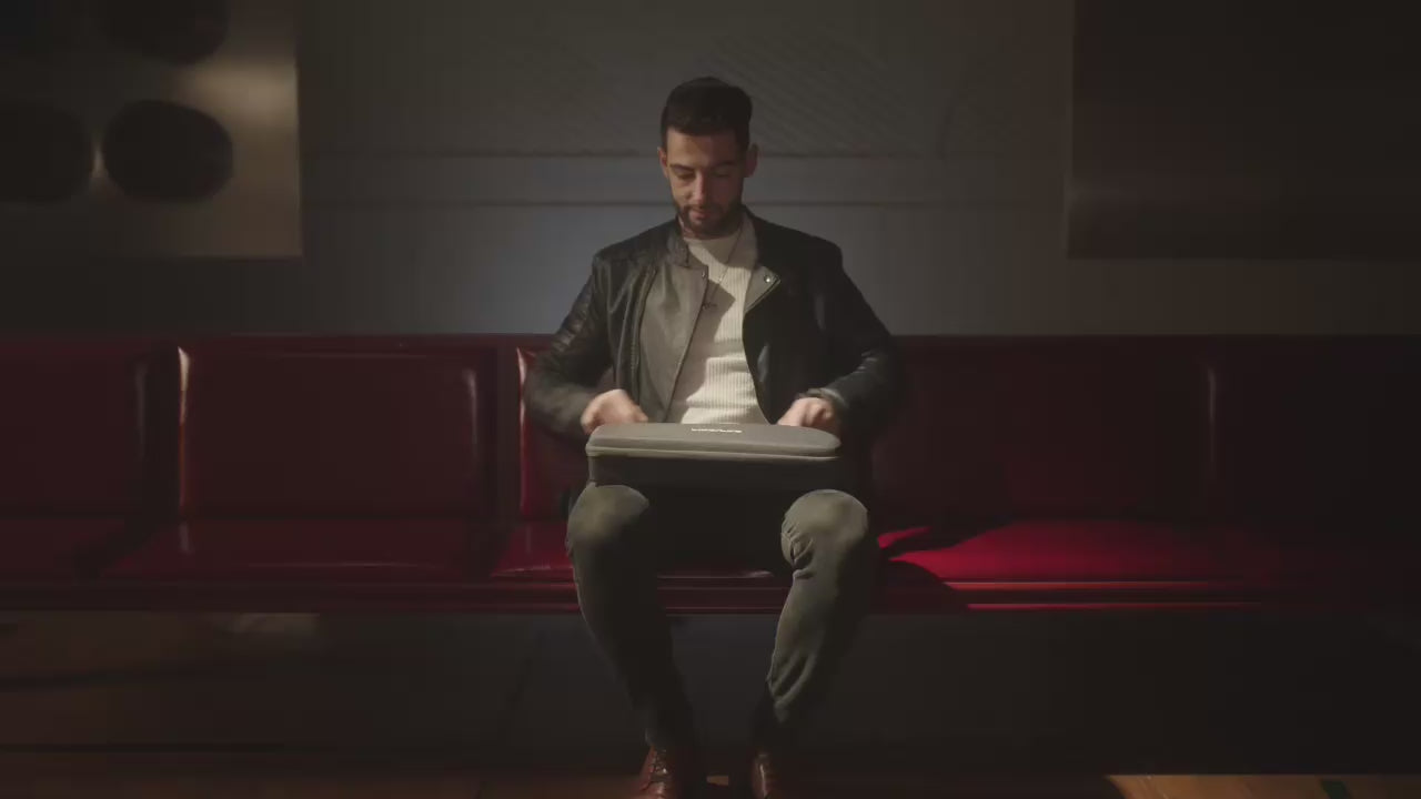 Load video: Desktop video of a person opening the LiberLive C1 carrying case for portable use.