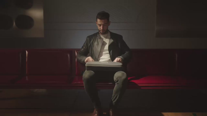 Desktop video of a person opening the LiberLive C1 carrying case for portable use.